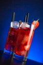 Two glasses of strawberry cocktail with ice on wood table Royalty Free Stock Photo