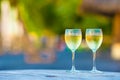 Two glasses of tasty white wine at sunset on Royalty Free Stock Photo