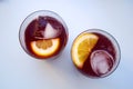 Two glasses with vine cocktail, lemon, ice, top view Royalty Free Stock Photo