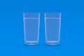 Two glasses of water on blue background Royalty Free Stock Photo