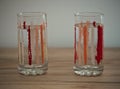 Two glasses of water on wooden table Royalty Free Stock Photo