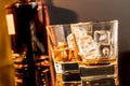 Two glasses of whiskey in front of whisky bottle Royalty Free Stock Photo