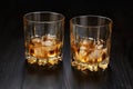 Two glasses of whiskey with ice cubes Royalty Free Stock Photo