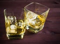 Two glasses of whiskey on old wood table Royalty Free Stock Photo