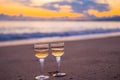 Two glasses on the white sandy beach Royalty Free Stock Photo