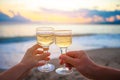 Two glasses on the white sandy beach Royalty Free Stock Photo