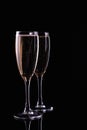 Two glasses with white wine champagne on a  black background Royalty Free Stock Photo