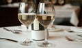 Two Glasses of White Wine and Bottle on a Table Setting Royalty Free Stock Photo