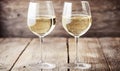 Two Glasses of Sparkling White Wine on Rustic Wooden Table Royalty Free Stock Photo