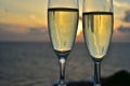 Two glasses of white wine with sunset on background Royalty Free Stock Photo