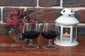 Two glasses of wine with grapes and candles Royalty Free Stock Photo