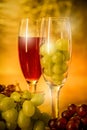 Cups of wine with grapes on a table Royalty Free Stock Photo