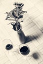 Two glasses of wine and one red rose in a vase Royalty Free Stock Photo