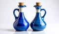 Two Glazed Blue Ceramic Bottles with Cork Stoppers on White Background Royalty Free Stock Photo