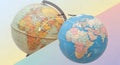 Two globes side by side on gradient background with world map and highlighted cities Boston and Chengdu connected by white line Royalty Free Stock Photo