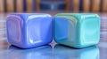 Two Glossy Cubes, Blue and Teal, Reflecting on a Polished Surface Royalty Free Stock Photo