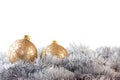 Two gold baubles in silver garland Royalty Free Stock Photo