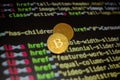 Two gold bitcoin coins on the background of lines of program code Royalty Free Stock Photo
