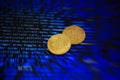 Two gold bitcoin coins on the background of lines of program code Royalty Free Stock Photo