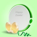 Two gold Easter eggs with a green tag on a light green background with ribbon. Royalty Free Stock Photo