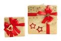 Two gold shiny paper wrap red star bell bow gift box christmas isolated Royalty Free Stock Photo