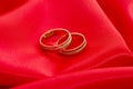 Two gold wedding rings on the red Royalty Free Stock Photo