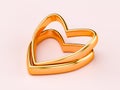 Two gold wedding rings in the shape of a heart. Love couple concept Royalty Free Stock Photo