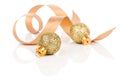 Two golden christmas decoration balls with satin ribbon Royalty Free Stock Photo