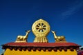 Two golden deer flanking a Dharma wheel on Jokhang