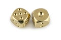 Two golden dices closeup isolated on white background. Five and one, with a shadow Royalty Free Stock Photo