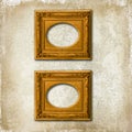 Two golden frames on a grunge wall Royalty Free Stock Photo