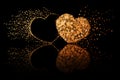 Two golden hearts on black background with reflection effect Royalty Free Stock Photo