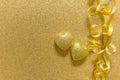 Two golden hearts on golden glitter backgound Royalty Free Stock Photo