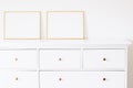 Two golden horizontal frames on white furniture, luxury home decor and design for mockup creation