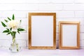Two golden poster frames mockup with white peony Royalty Free Stock Photo
