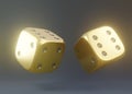 Two golden rolling gambling dice in Flight on a black background Royalty Free Stock Photo