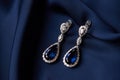 Two Golden sapphire earrings with small diamonds