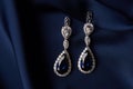 Two Golden sapphire earrings with small diamonds