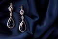 Two Golden sapphire earrings with small diamonds