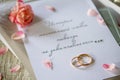 Two Golden Wedding Rings, box of chocolates and a wedding invitation, an inscription that the story of true love never ends Royalty Free Stock Photo