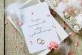 Two Golden Wedding Rings, box of chocolates and a wedding invitation, an inscription that the story of true love never ends. Royalty Free Stock Photo