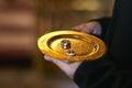 Two Golden Wedding Rings  on a  bronze plate Royalty Free Stock Photo