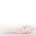 Two Golden Wedding Rings and Feather - soft, white Royalty Free Stock Photo