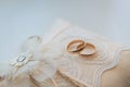 Two golden wedding rings on a lace pad Royalty Free Stock Photo