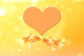 Two goldfish in love and heart symbol on a yellow background