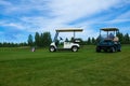 Two golf carts on the golfe course Royalty Free Stock Photo