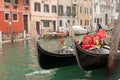 Two gondola in Venice near pier