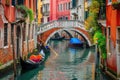 Two gondolas peacefully resting in the water of a serene canal in the enchanting city of Venice, A colorful Venetian canal with