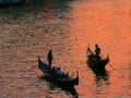 Two gondolas at sunset