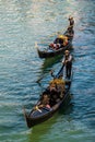 Two gondolas with tourists around grand canal  in the evening before autumn in Venice , Italy Royalty Free Stock Photo